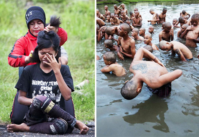 An Indonesian policewoman cuts the hair of a detained punk at a police school in Aceh Besar